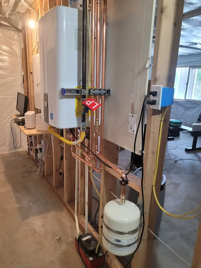 Licensed plumber repairing a kitchen sink in Athens